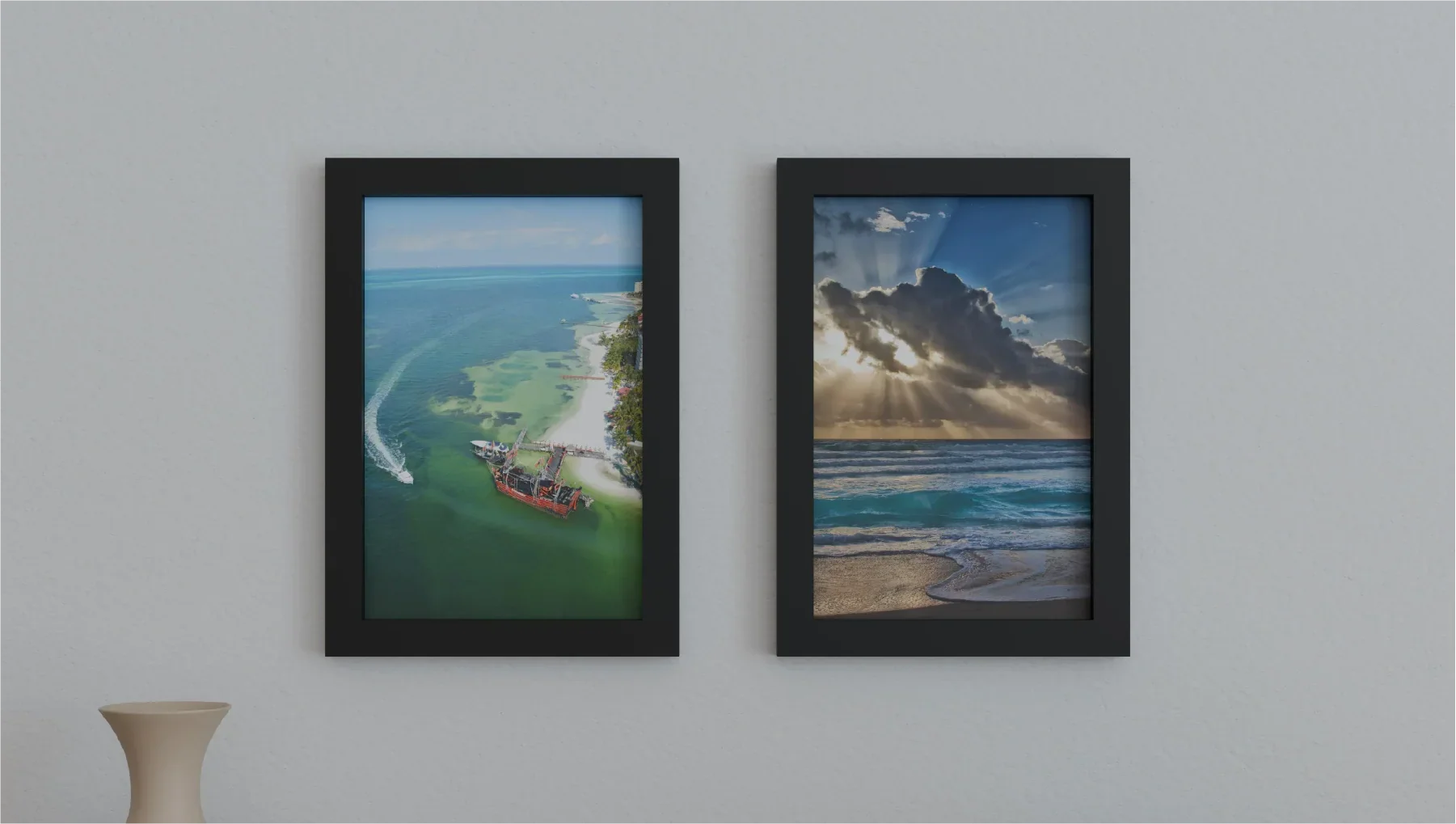 Two 12x18 solid wood picture frames with tempered glass hung up on a wall.