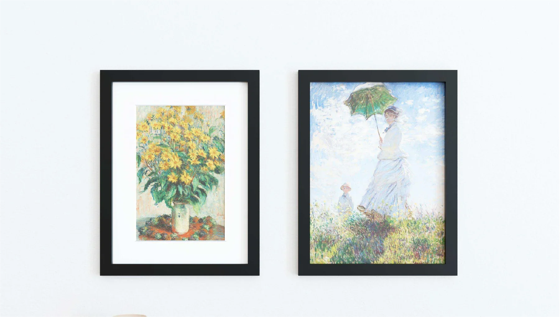 Two 18x24 frames featuring black solid wood borders and tempered glass covers hung up on a wall.